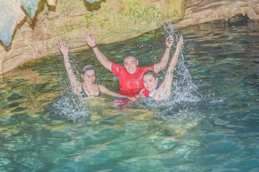 From Bávaro: Double Buggy Tour to Macao Beach and Cenote - Taino cave cenote: turquoise water, plus the crowd factor